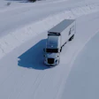 A screenshot of Range Energy's production-spec eTrailer undergoing winter testing on an icy and snow-covered road in Michigan's Upper Peninsula.