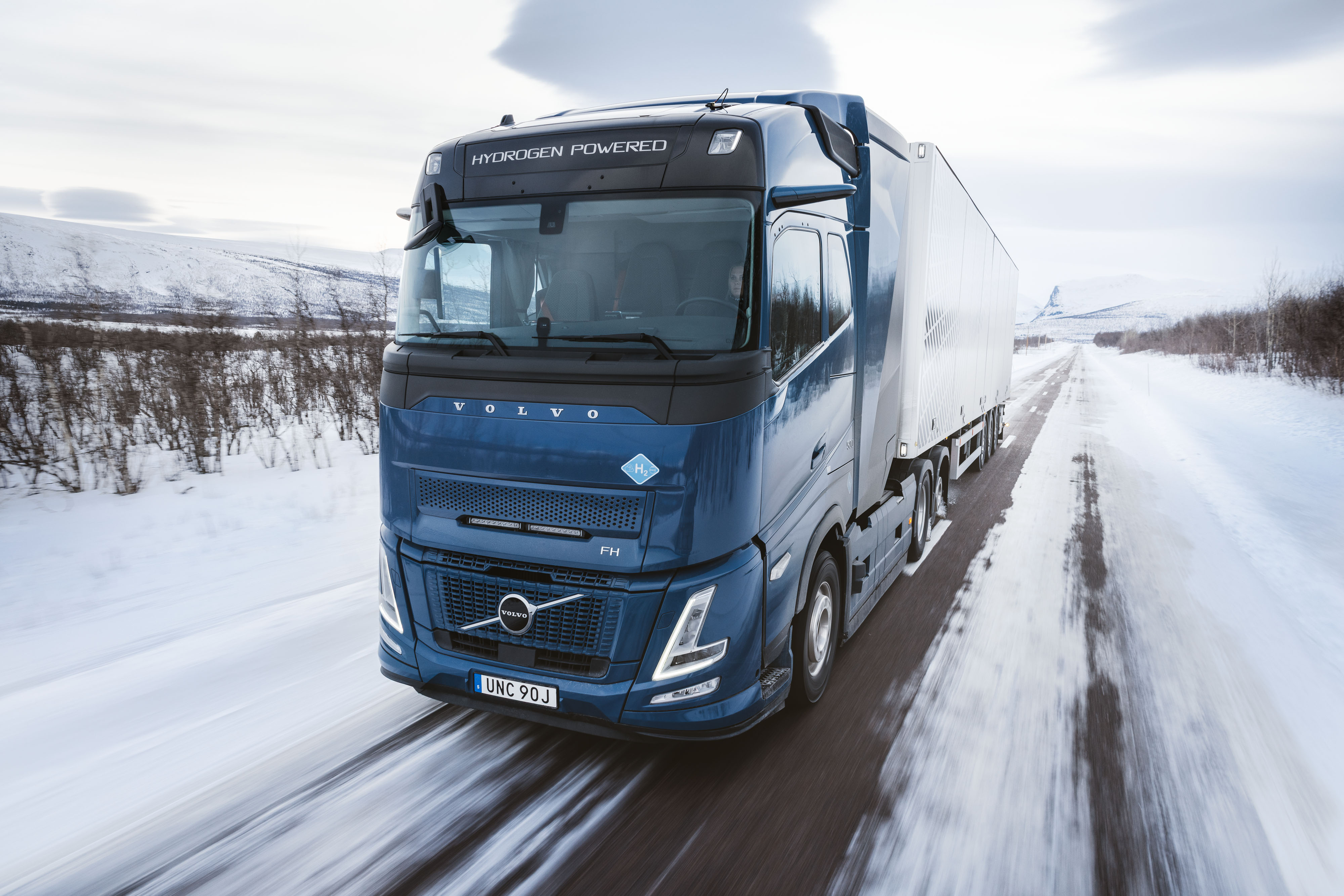 Volvo's hydrogen combustion-powered truck navigating snow-covered European roads.