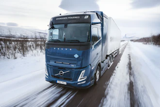 Volvo's hydrogen combustion-powered truck navigating snow-covered European roads.
