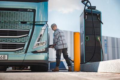 Volvo Trucks FH Aero Electric with extended range at a charging station.