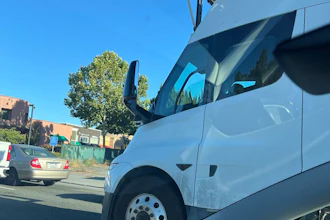 A white Tesla Semi equipped with self-driving hardware undergoing public road testing in California.