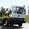 The Kalmar Ottawa T2 battery-electric terminal tractor driving on the road.
