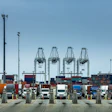 A row of Class 8 drayage semi-trucks at the Port of Los Angeles.