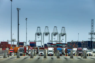 A row of Class 8 drayage semi-trucks at the Port of Los Angeles.